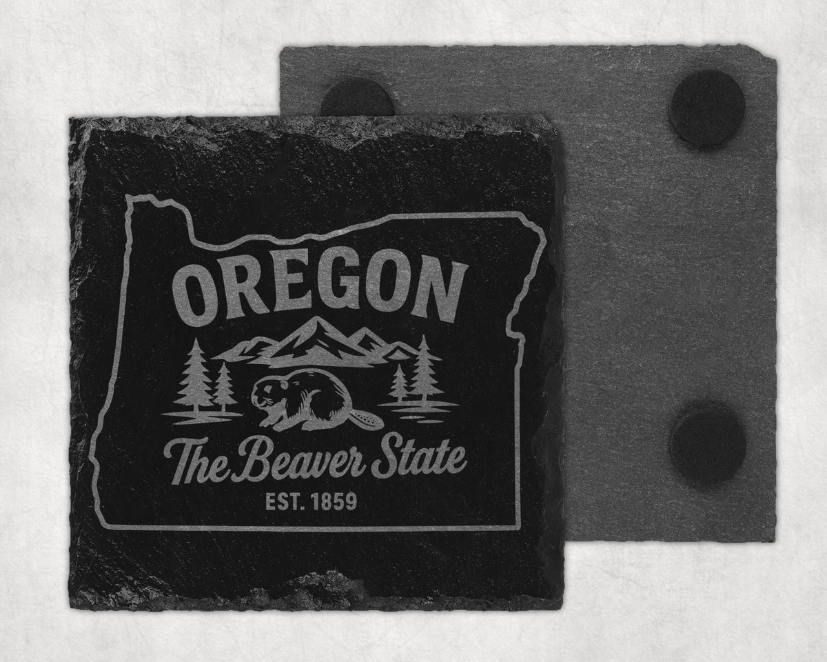 Black slate coaster with Oregon outline, beaver, trees, mountains, and text.