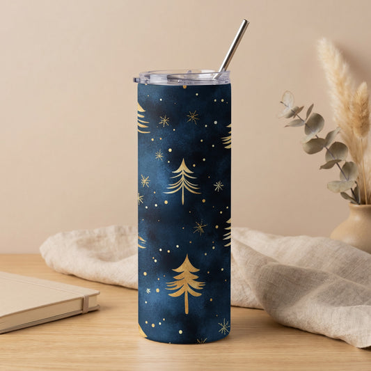 Dark blue tumbler with gold Christmas trees and snowflakes pattern, metal straw.