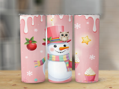 Three pink tumblers featuring a snowman with an owl, cupcakes, and holiday ornaments.