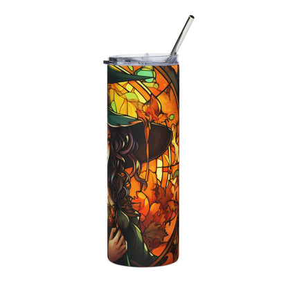 Tumbler with a witch and autumn leaves stained glass design and metal straw.