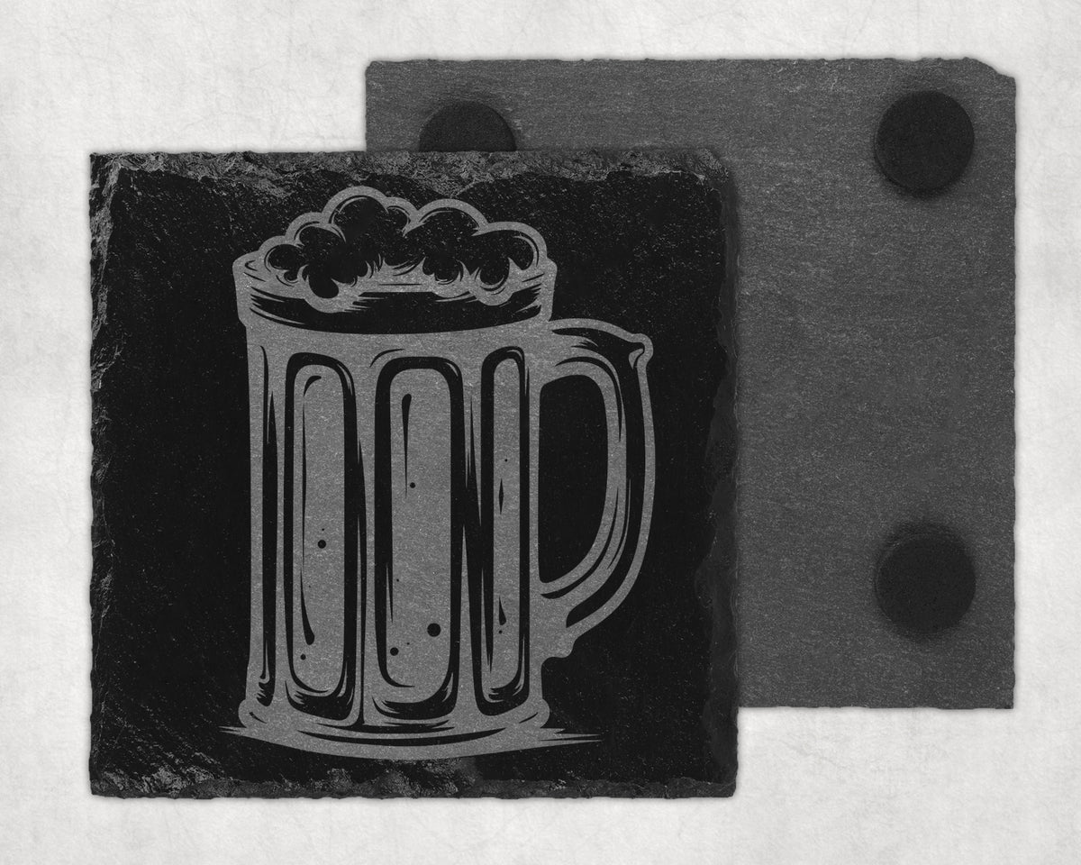 Engraved beer mug design on a black slate coaster with a second coaster behind it.