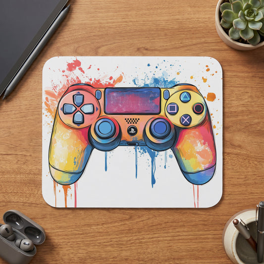 Gaming controller with a colorful watercolor splash design on a white mat.