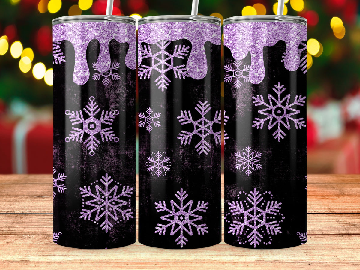 Three black tumblers with purple glitter drips and snowflakes on a wooden surface.