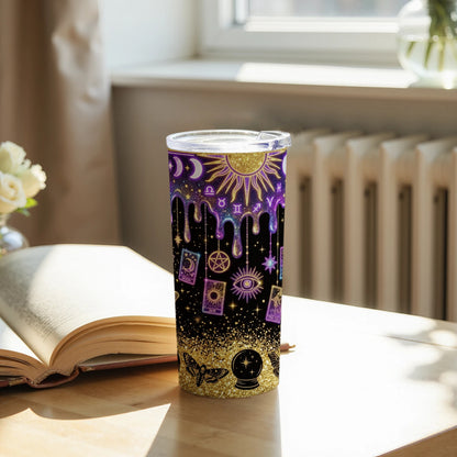 Tumbler with celestial and occult symbols, including sun, moon, eye, and tarot cards.