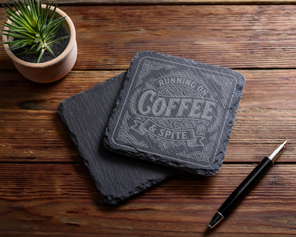 Slate coaster engraved with "Running on Coffee & Spite" text.
