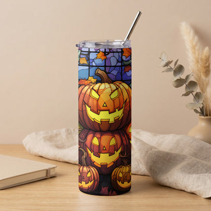 Tall tumbler with carved jack-o'-lanterns and stained glass pattern.