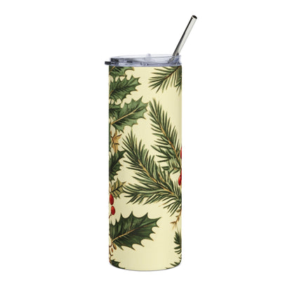 Tall tumbler with a festive holly and pine needle pattern and a silver straw.
