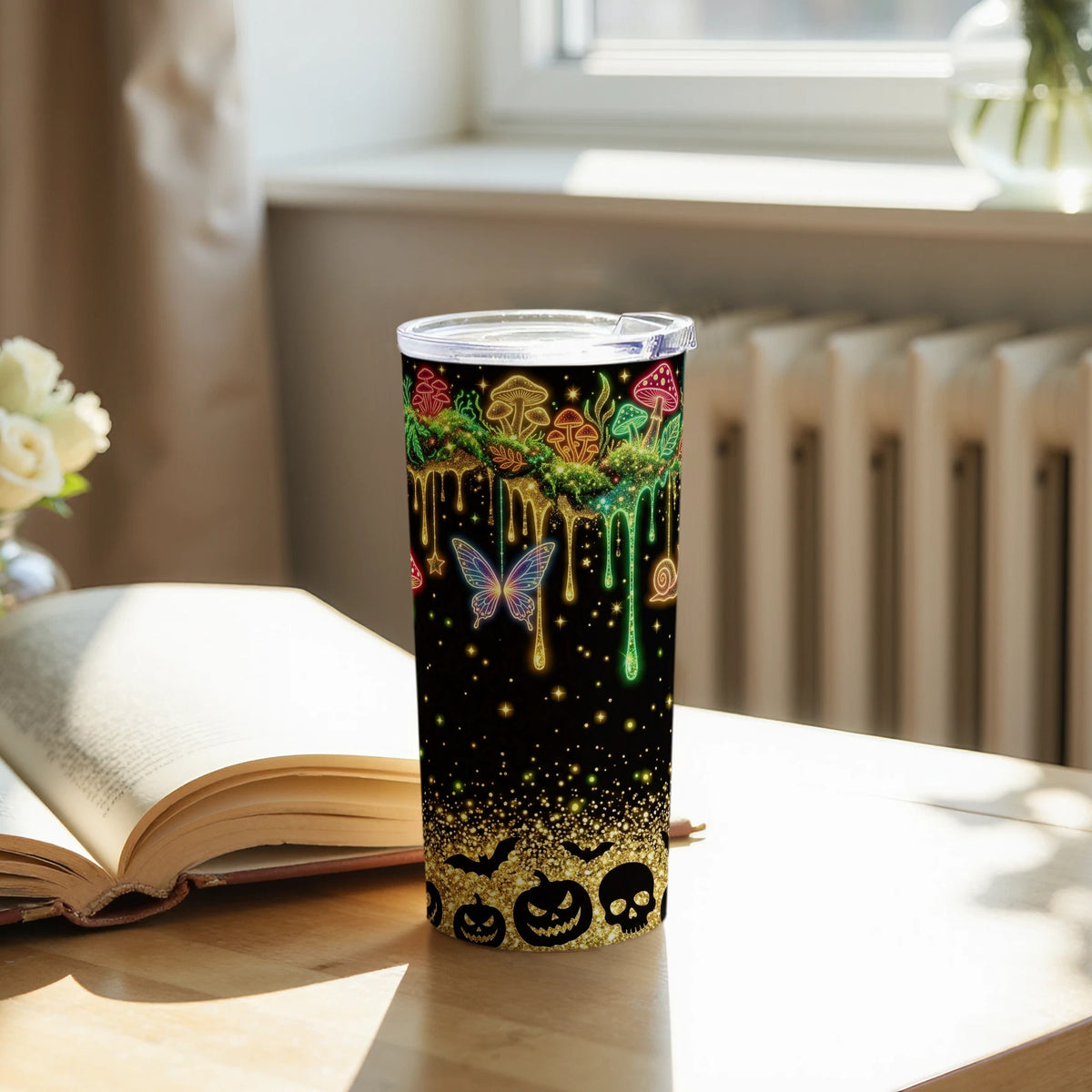 Black tumbler with neon mushrooms, butterfly, snail, and Halloween icons.