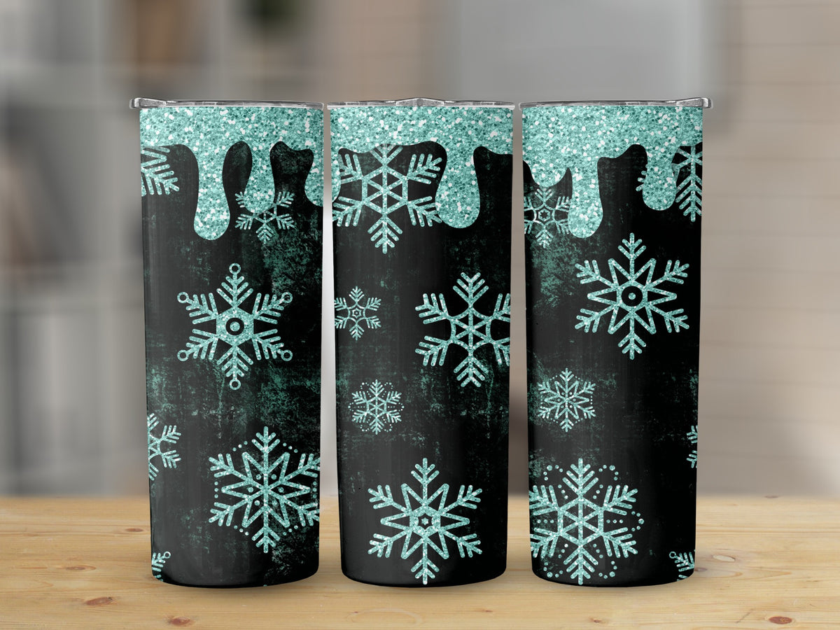 Three tumblers with a black background, glittery teal dripping, and teal snowflakes.