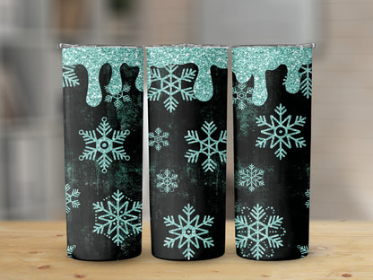 Three tumblers with a black background, glittery teal dripping, and teal snowflakes.