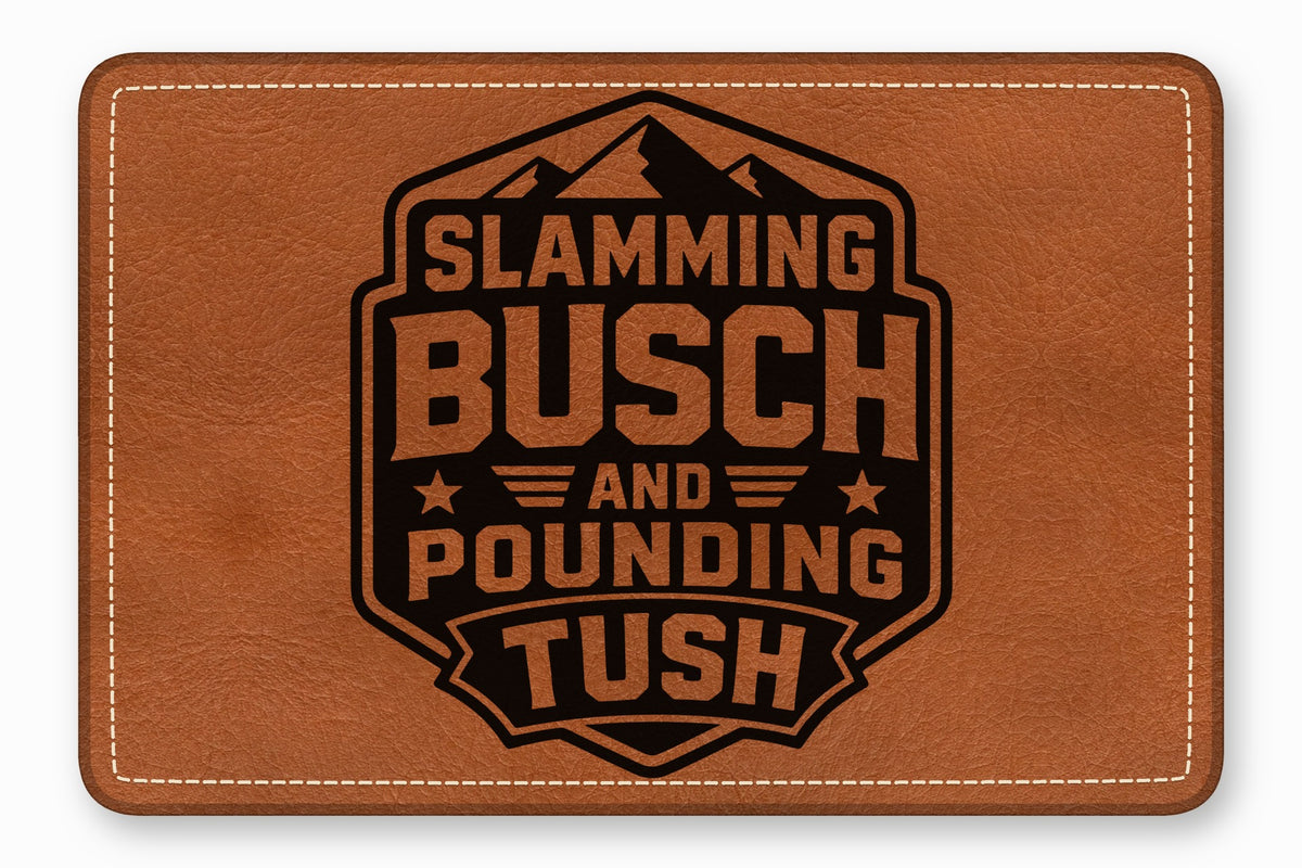Brown leather patch with rounded corners, white border stitching, and a black laser-engraved mountain badge design.