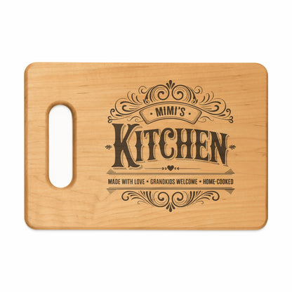 Wooden cutting board with "Mimi's Kitchen" and decorative text.