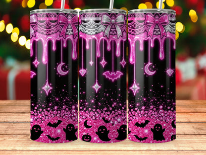 Three black tumblers with pink glittery Halloween design and bows.