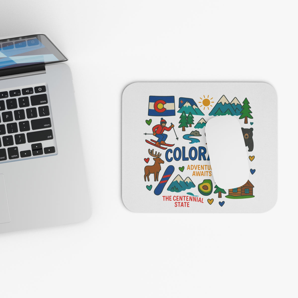 Colorado themed mousepad with mountains, skier, bear, deer, and text.