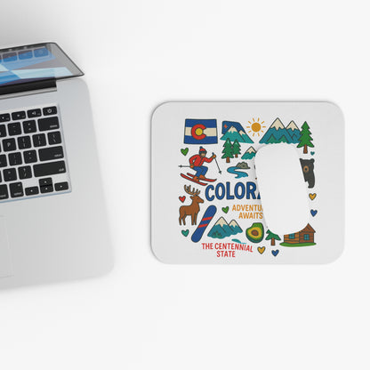 Colorado themed mousepad with mountains, skier, bear, deer, and text.