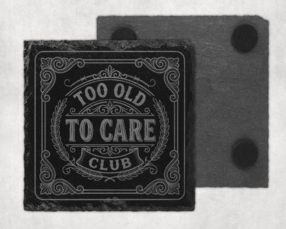 Slate coaster with "Too Old To Care Club" text and decorative border.