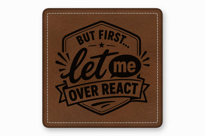 Square brown leather patch with white stitched border, featuring the text But First... Let Me Overreact.