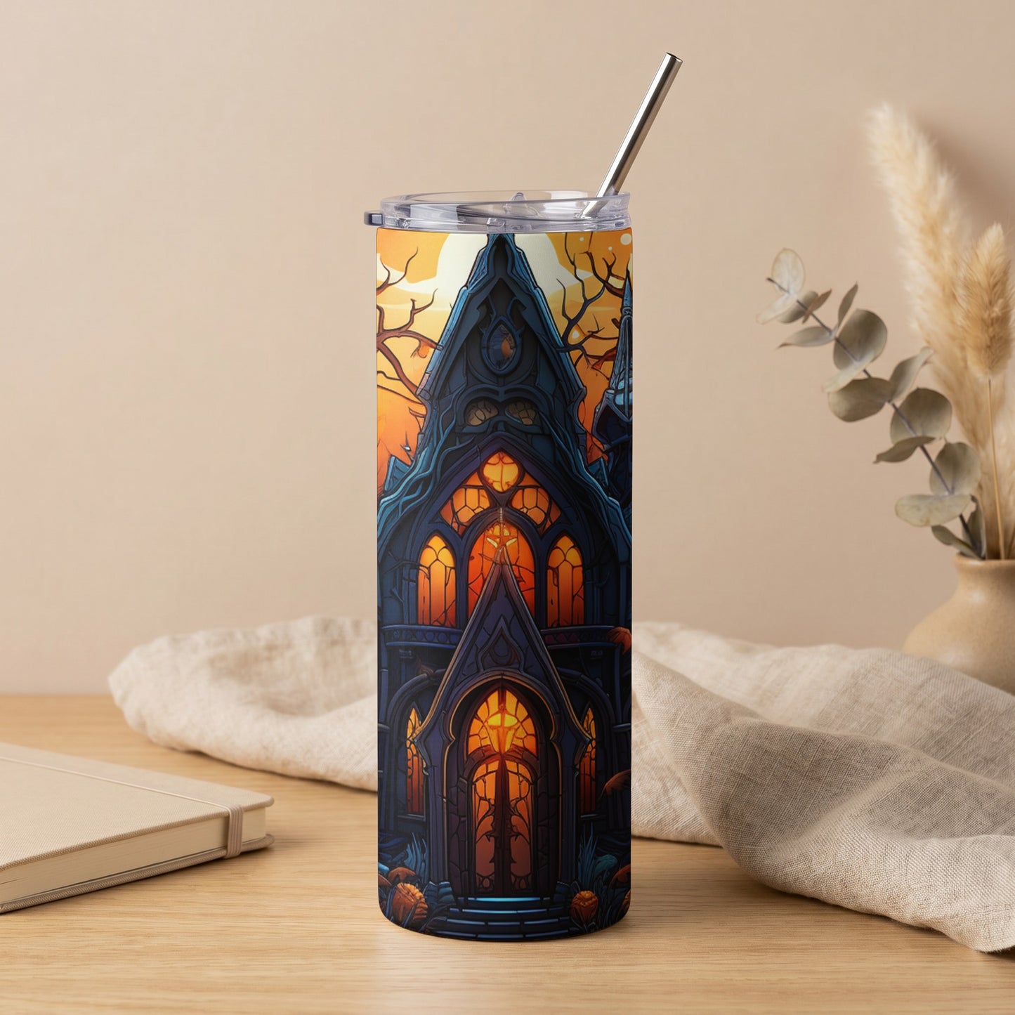 Tumbler with a gothic haunted house and pumpkins design, silver straw.