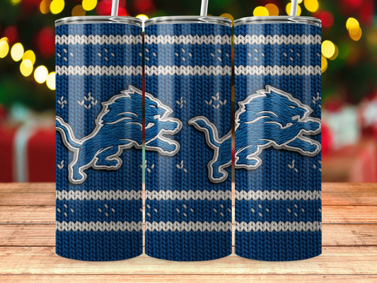 Blue knit tumbler with Detroit Lions logo, holiday background.