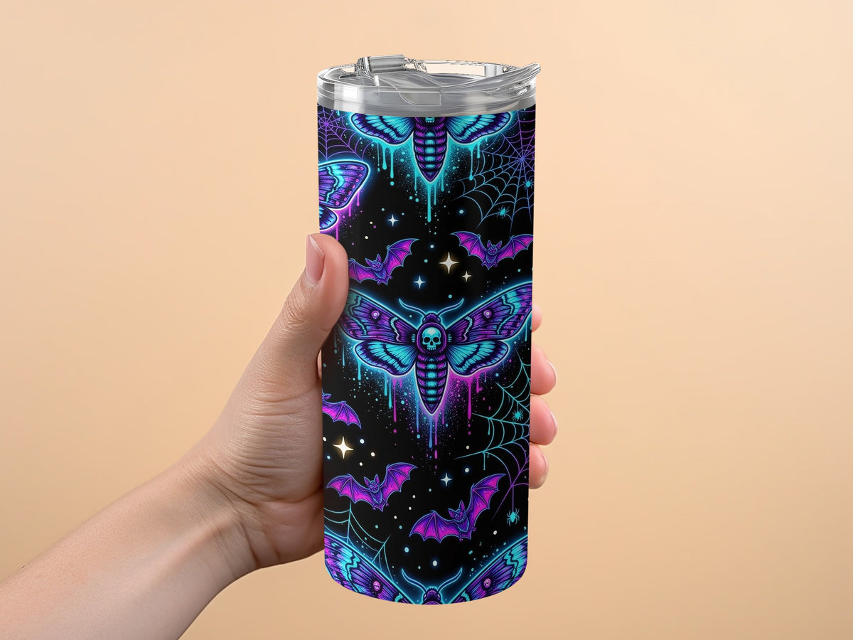 Tumbler with neon moths, bats, and spiderwebs on a black background.