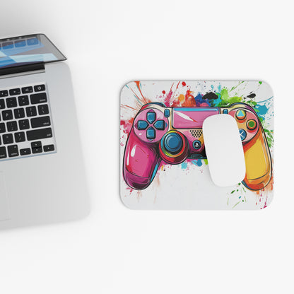 Mousepad with colorful splatter art and a pink gaming controller design.