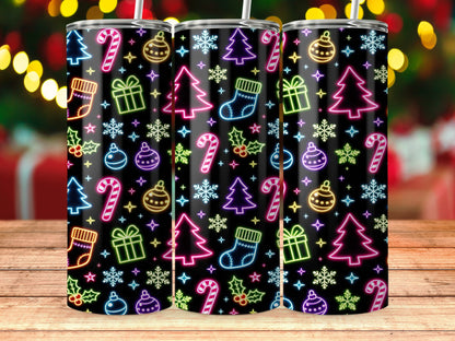 Three tumblers with neon Christmas icons on black background.