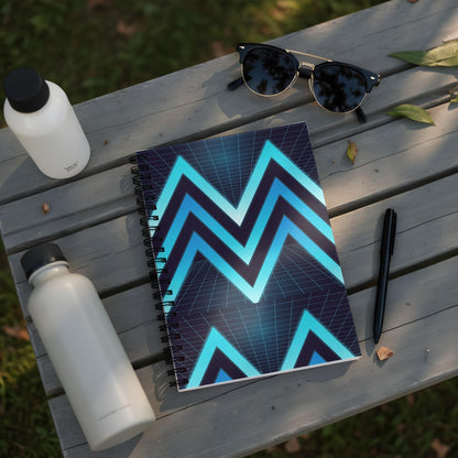 Spiral notebook with a retro neon chevron pattern on a wooden table.
