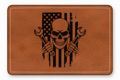 Brown faux leather patch featuring a distressed American flag, skull, and crossed wrenches graphic with white border stitching.