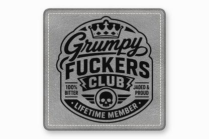 Gray leather patch with white stitched border and black emblem featuring skull and text.