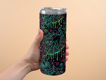 Black tumbler with neon Halloween pattern featuring cats, spiders, and cobwebs.
