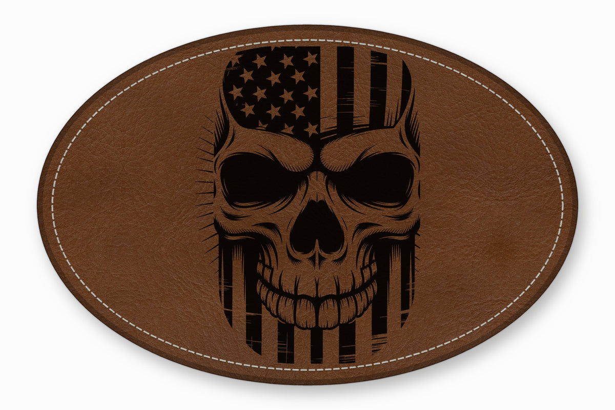 Brown oval leather patch featuring an engraved black skull graphic combined with an American flag.