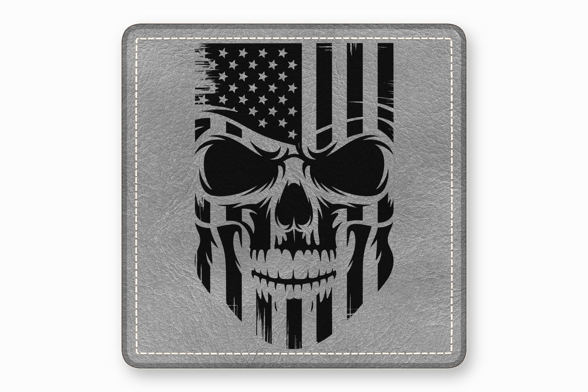 A square, gray leather patch featuring a distressed black American flag skull graphic and white perimeter stitching.