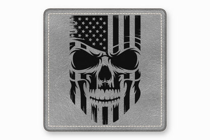 A square, gray leather patch featuring a distressed black American flag skull graphic and white perimeter stitching.