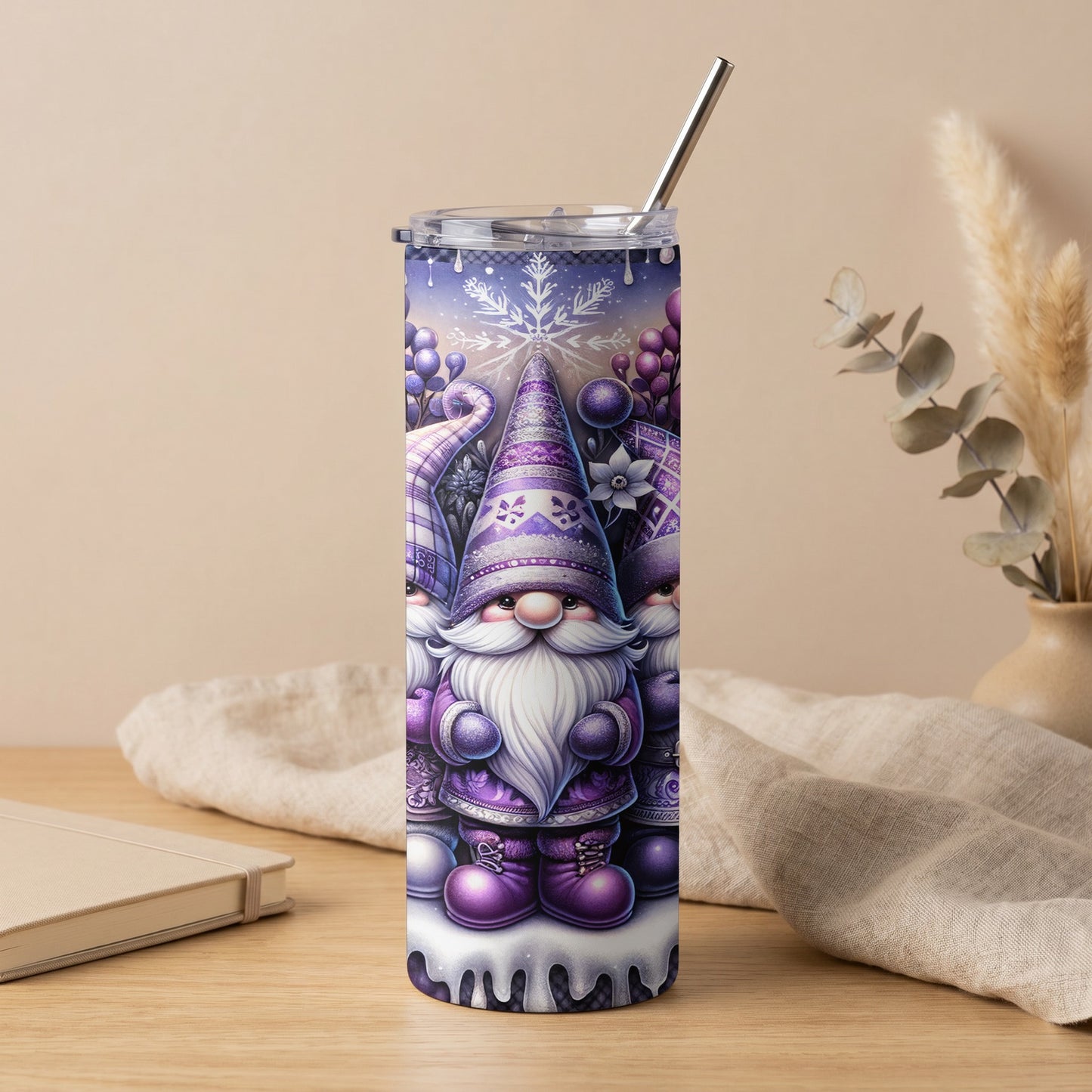 Purple gnomes and snowflake design on a tumbler with a silver straw.