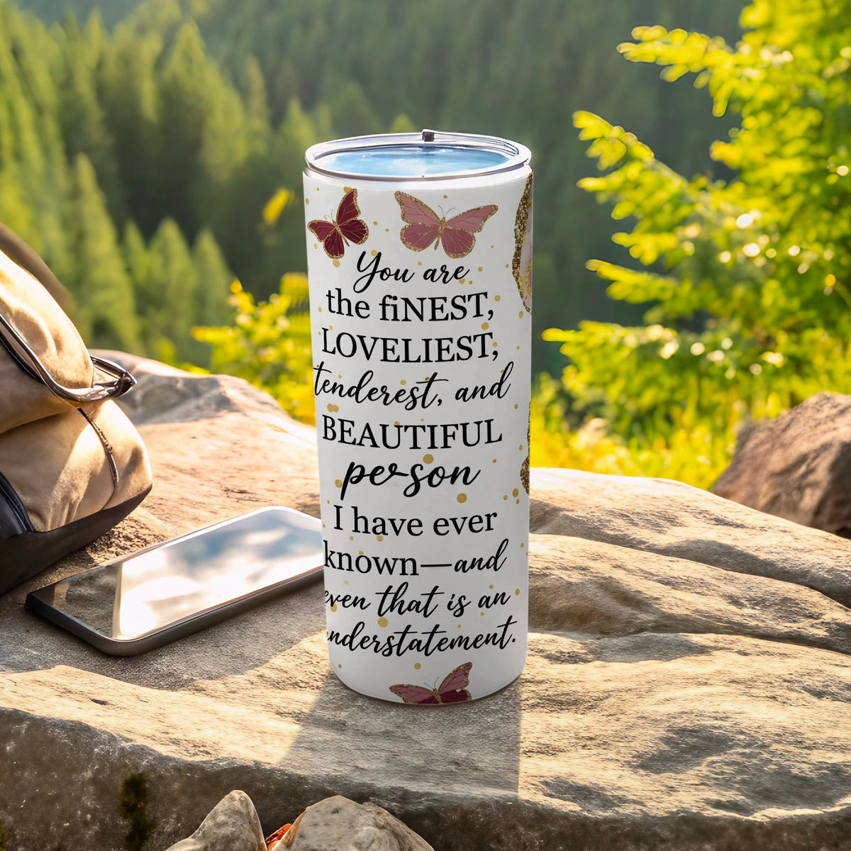 White tumbler with butterflies and text "You are the finest, loveliest, tenderest, and beautiful person I have ever known—and even that is an understatement."
