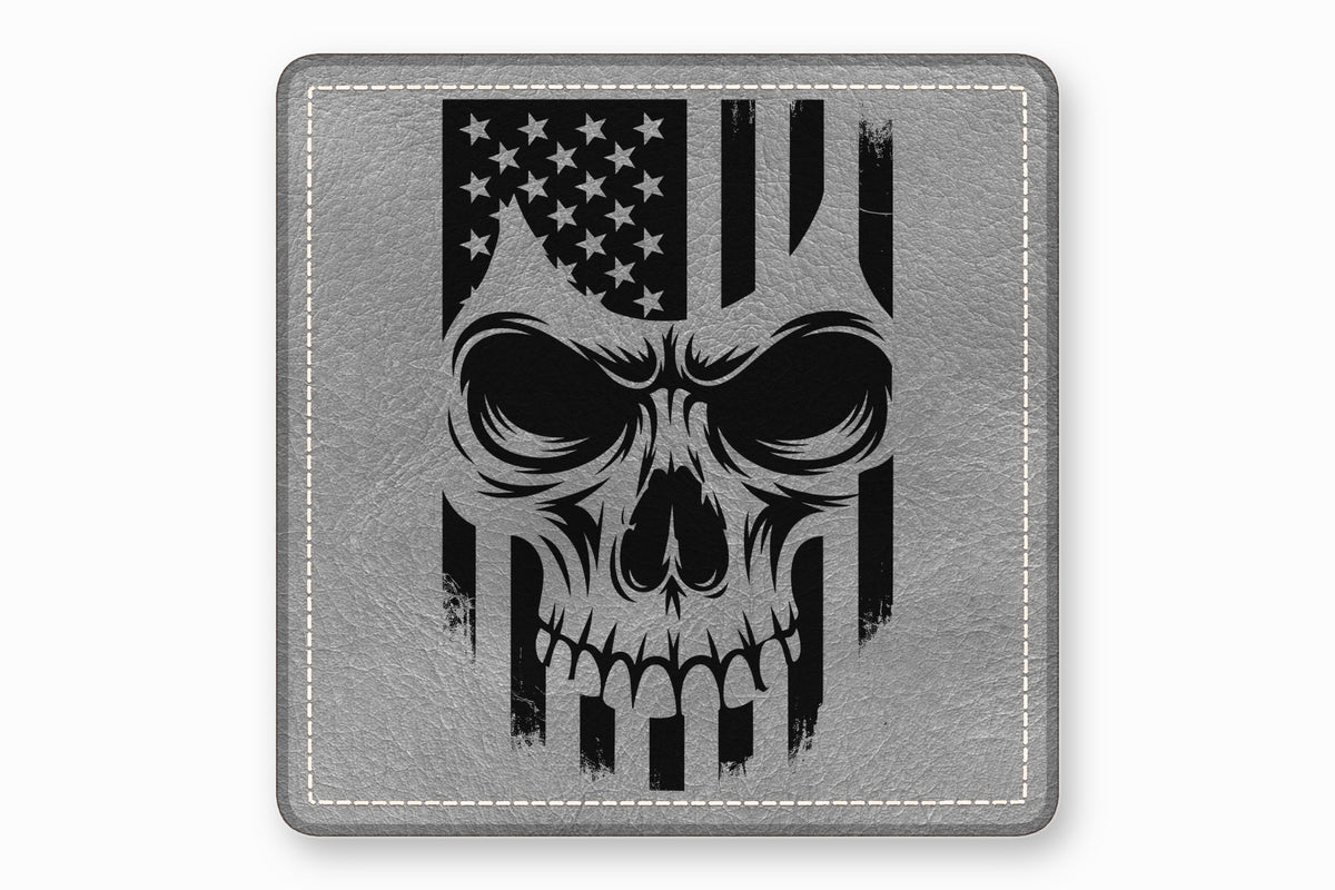 A square grey leather patch features a black graphic of a skull overlaid with an American flag.