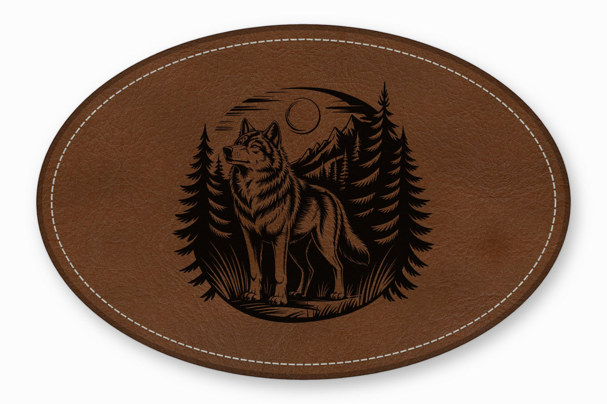 Brown leather oval patch featuring an engraved black illustration of a wolf in a forest.