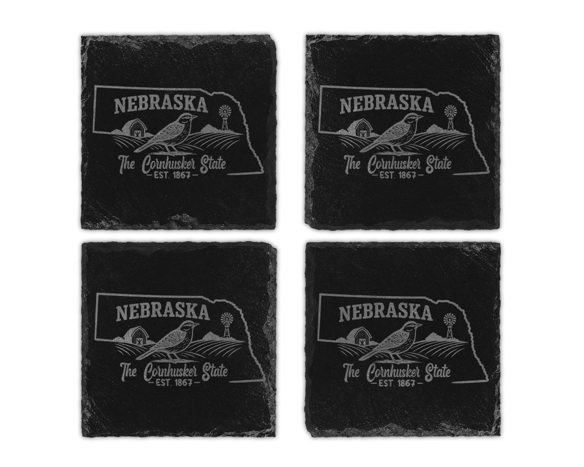 Four Nebraska state outline coasters with farm scene and text.