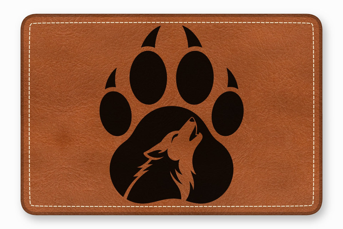 Brown leather rectangle featuring a black paw print with a howling wolf silhouette inside.