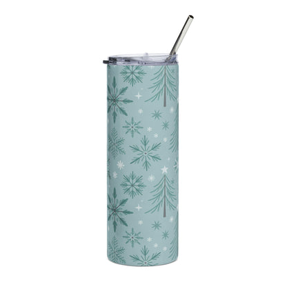 Light blue tumbler with repeating snowflake and pine tree pattern and metal straw.