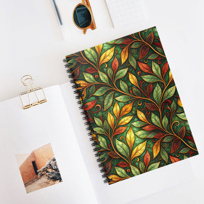 Spiral-bound notebook with a green and gold art nouveau leaf pattern.