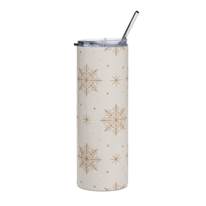 Cream tumbler with gold snowflake pattern and metal straw.