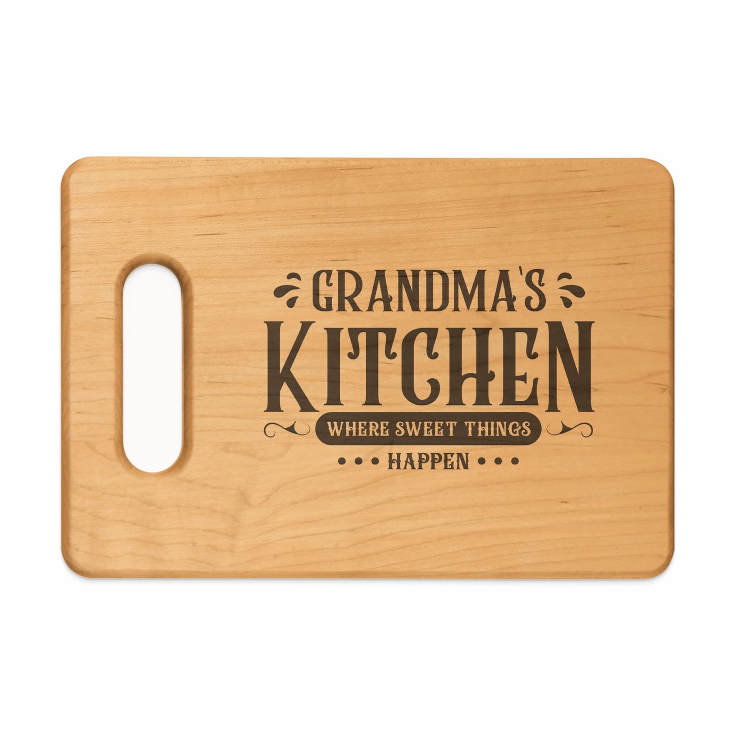 Wooden cutting board with "Grandma's Kitchen Where Sweet Things Happen" engraved text.
