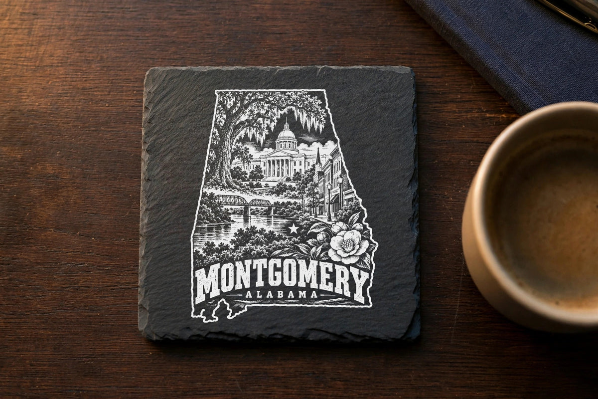 Square black slate coaster engraved with an outline of Alabama featuring Montgomery landmarks, flowers, and text.