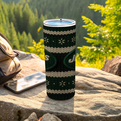 Green and white knit tumbler with "Jets" logo outdoors on rock.