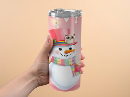 Tumbler with a cheerful snowman wearing a pink hat and striped scarf, holding a cupcake.