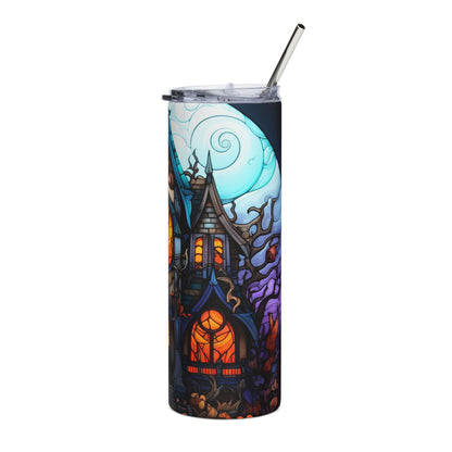 Tumbler with a spooky haunted house, moon, and autumn foliage design.