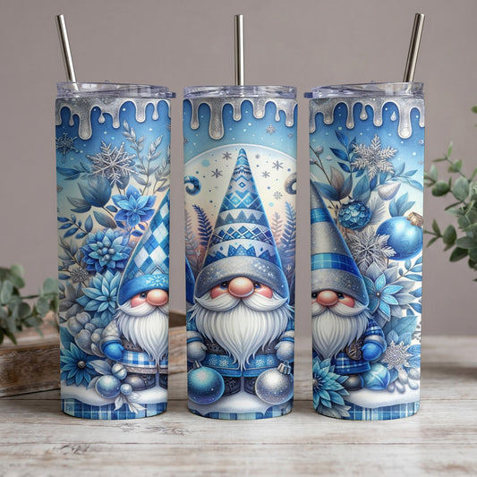 Three tumblers featuring blue winter gnomes, snowflakes, flowers, and silver dripping accents.