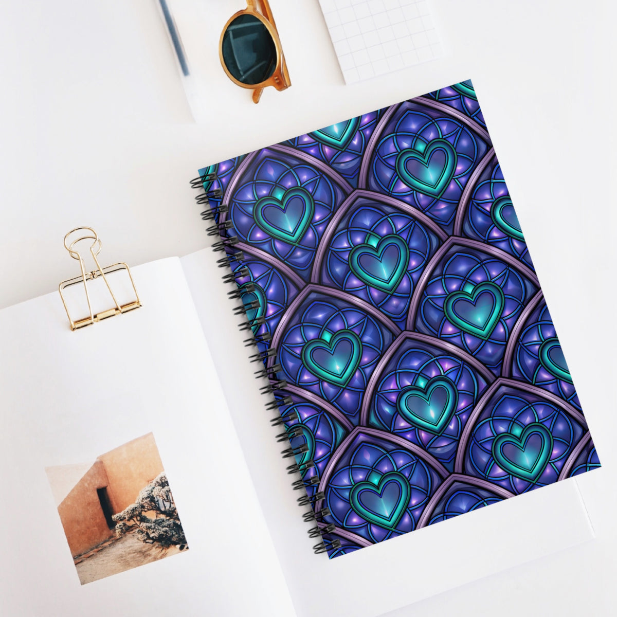 Spiral notebook with a blue and purple stained glass heart pattern.