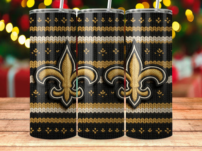 Three tumblers with a black, gold, and white striped knit pattern and a gold fleur-de-lis.
